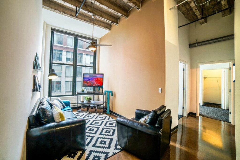 Living room of a model apartment at Tailor Lofts